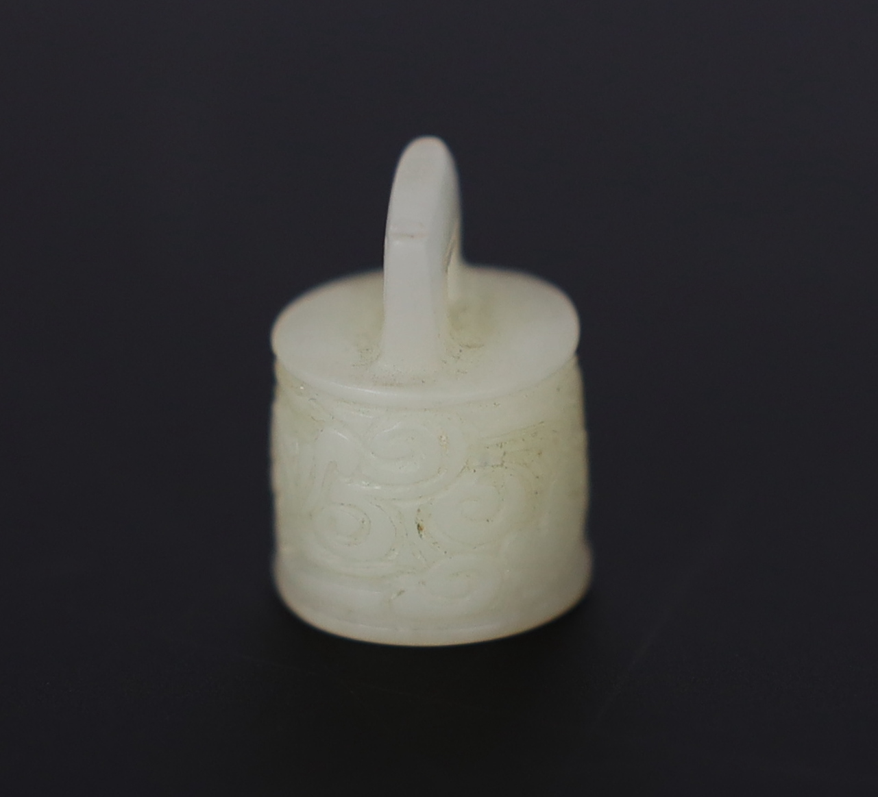 A Chinese miniature white jade seal of archaic bronze bell form, late Qing dynasty